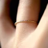 TWISTED THIN STACKING RING